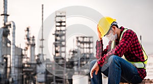 Unemployed concept from coronavirus or covid 19 crisis. Engineer asian man wearing yellow safety helmet, goggle and face mask