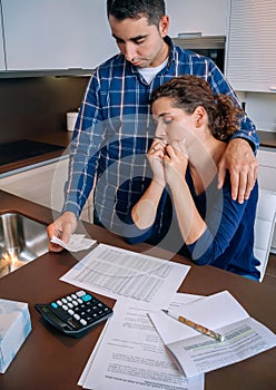 Unemployed husband gives solace to his wife crying