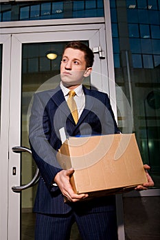 Unemployed manager leaving business center