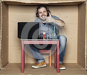 Unemployed student sitting in his room playing video games