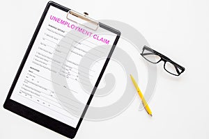 Unemployment claim form on white background top view