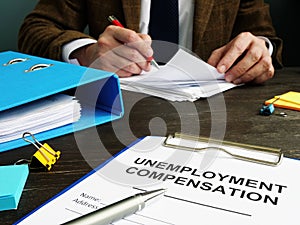 Unemployment compensation application and clerk with papers