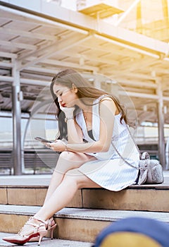 Unemployment problem concept,Asian beautiful woman stressed and depression from work while sitting outdoor