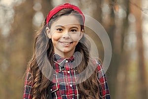 Unequaled in beauty. Beauty look of adorable child. Happy little beauty outdoors. Small girl smile with long brunette