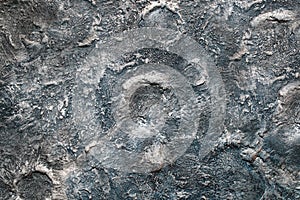 Uneven harsh surface texture of motlen and solidified metal