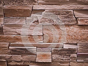 Uneven stone facade close-up. Torn stone texture. Stone wall. Stonewall abstract background