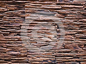 Uneven stone facade close-up. Torn stone texture. Stone wall. Stonewall abstract background