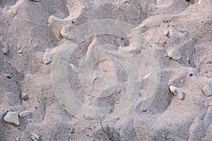 Uneven surface of yellow sand. A pile of sand in the sun bens