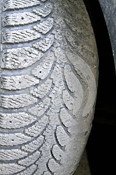 Unevenly worn car tire. Dangerous photo