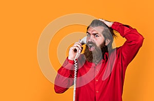 unexpected call. telephone conversation. bearded man. communication in modern life. speak with friend on phone. mature