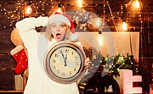 Unexpectedly soon. Midnight concept. Make wish. Woman Santa hat hold vintage clock. Time to celebrate. Merry christmas