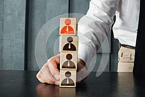 Unfair selection and career development and leadership are shown with wooden cubes and icons of employee