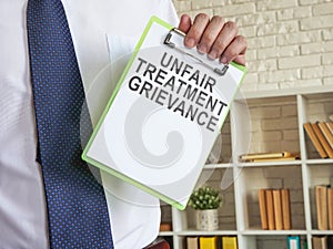 Unfair treatment grievance with clipboard in the hands.