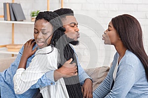 Unfaithful Black Boyfriend Kissing Another Girl While Hugging His Girlfriend