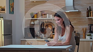 Unfaithful wife chatting in the kitchen