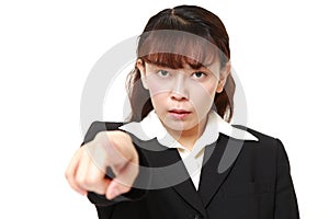 Unfashionable Asian businesswoman scolding