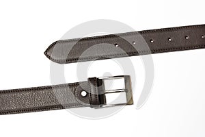 Unfastened brown leather belt