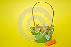 Unfilled Easter basket isolated on yellow background.