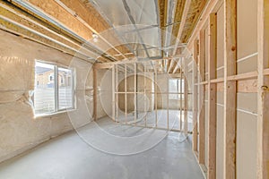 Unfinished basement with wood framing and insulated walls