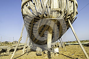 unfinished basic construction of wooden fishing ships.