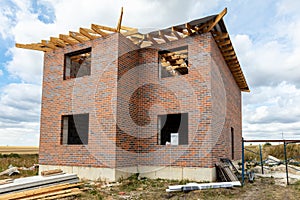 Unfinished brick cottage in the village