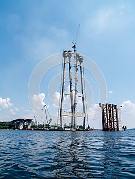 Unfinished bridge. bridge support construction. beautiful view of the bridge from the surface of the water