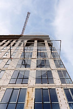 Unfinished cement building at a construction site. Energy efficiency house wall renovation for energy saving