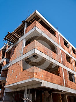 Unfinished construction bulding against blue sky