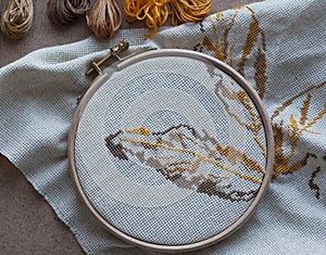 Unfinished embroidery autumn leaf closeup