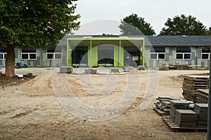 Unfinished green exterior school building