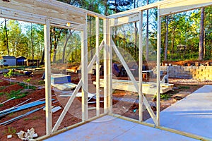 A an unfinished interior new house with wooden framing supporting beams