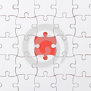 Unfinished jigsaw puzzle texture on red background. connection concept. idea concept.association concept
