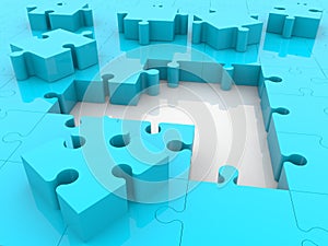 Unfinished light blue puzzle on white
