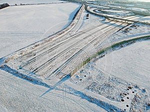 Unfinished motorway D0 R1 by D1 highway in winter - motorway ending in field