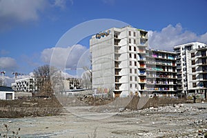 Unfinished residential building covered with graffiti - abandoned real estate project, bankruptcy concept