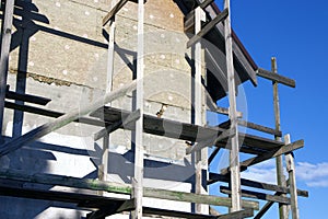 Unfinished residential home in construction progress at building site