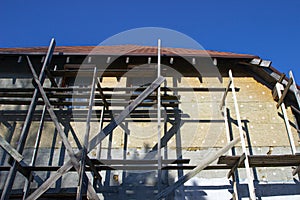 Unfinished residential home in construction progress at building site