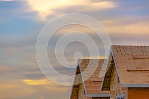 Unfinished roofs against glowing sky in Daybreak