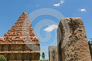 Unfinished and ruined pillars with main tower in the Brihadisvara Temple in Gangaikonda Cholapuram, india.