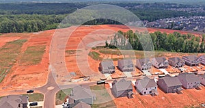 Unfinished subdivision housing construction site from an aerial perspective
