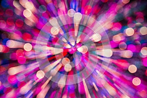 unfocused colorful streaking light background, abstract lens zoom flare, concept image of amusement, happy, speed, space