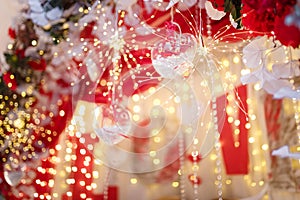 Unfocused shot of 14 February Valentines Day background. Shiny sparkling garland lights, flowers, hearts and bokeh. photo