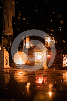 Unfocused vertical photography Halloween festive aesthetic of cemetery candle lamp light with sparks