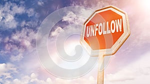 Unfollow, text on red traffic sign