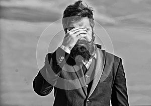 Unforgivable mistake. Business failure. Man bearded stressful painful face sky background. Guy suffer headache stressful