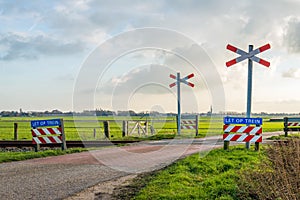 Unguarded level crossing in the Netherlands photo