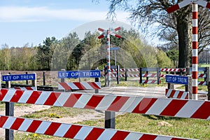 Unguarded railway crossing guarded with gates photo