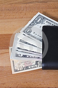 Unguarded wallet with lots of cash. photo