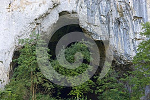 The entrance portal of Unguru Mare cave, Apuseni Mountains, Occidental Carpathians, Transylvania, Romania, Europe. photo