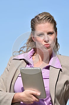 Unhappy Adult Blonde Business Woman Wearing Suit With Tablet